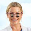 Woman wearing Enova's Galilean loupes on a pink Airon standards frame